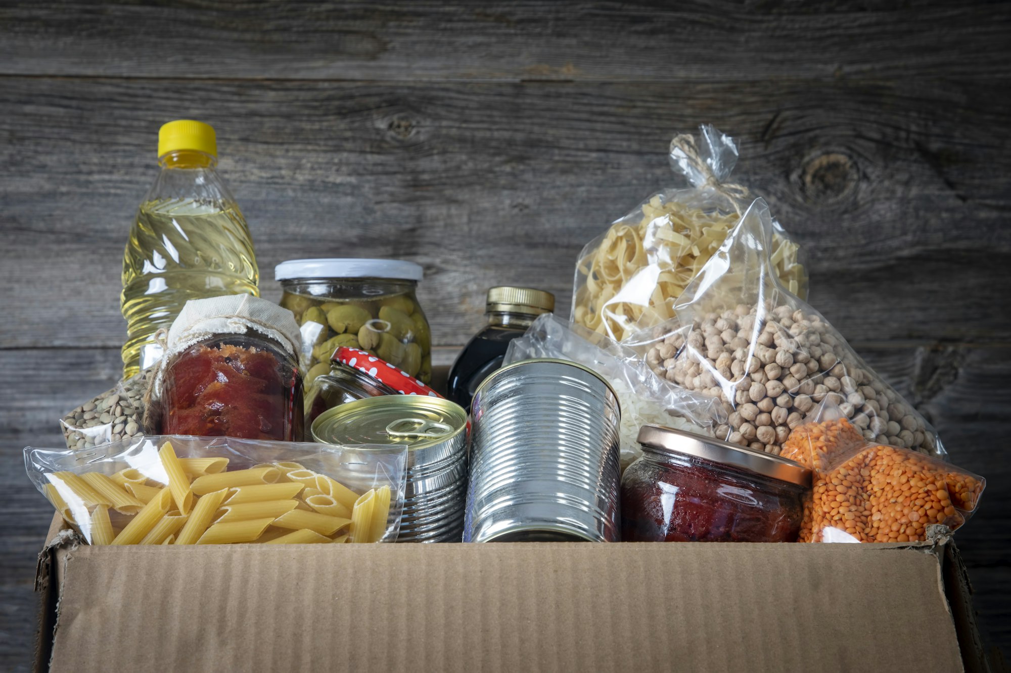 Volunteer with box of food for poor . Ramazan kolisi . Donation concept